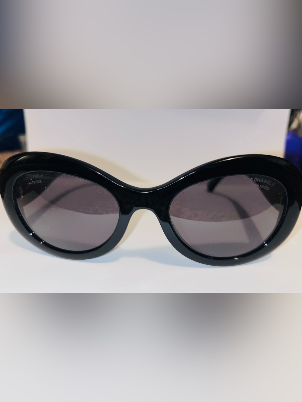 CHANEL Black Oval Women's Sunglasses with Gray Lenses